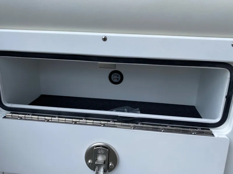 Slide: The Image of Open storage compartment in 2023 JC Neptoon Sport 23TT boat. - 11