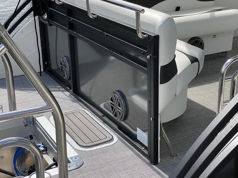 Slide: The Image of 2023 JC Neptoon Sport 23TT boat interior with seating and speakers. - 19