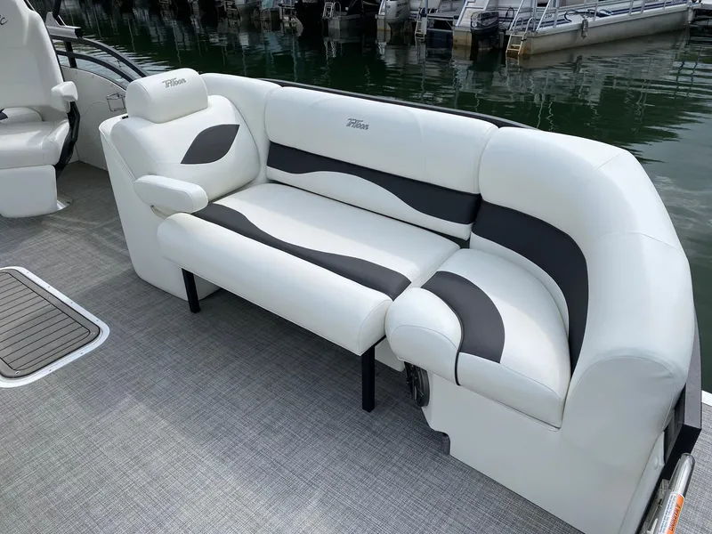 Slide: The Image of 2023 JC Neptoon Sport 23TT pontoon boat with white and black cushioned seating. - 4