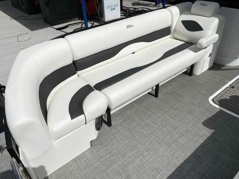 Slide: The Image of 2023 JC Neptoon Sport 23TT boat with white and black cushioned seating. - 5