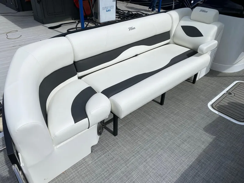 Slide: The Image of 2023 JC Neptoon Sport 23TT boat with white and black cushioned seating. - 6