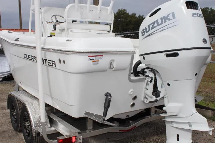 Slide: The Image of 2024 Clearwater 2200 boat with Suzuki 200 outboard motor on trailer. - 3