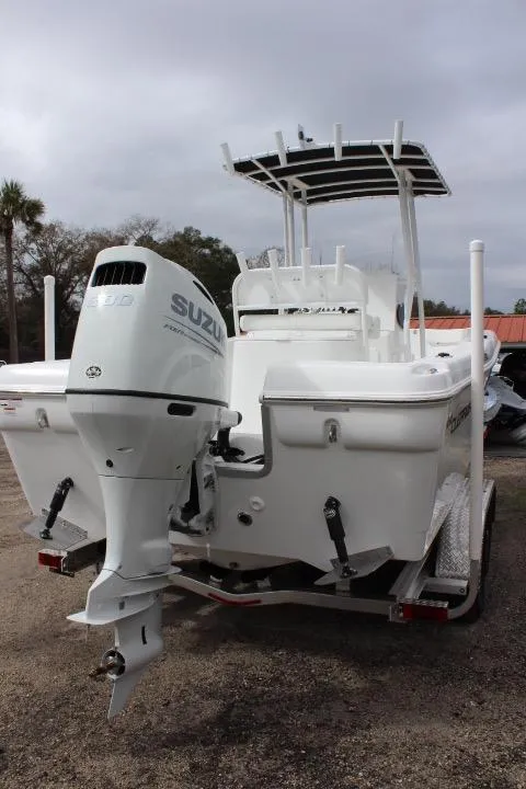Slide: The Image of 2024 Clearwater 2200 boat with Suzuki outboard motor, rear view. - 9