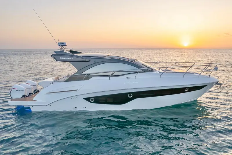The Image of 2025 Schaefer 400 Sport yacht cruising at sunset on the ocean. - 0