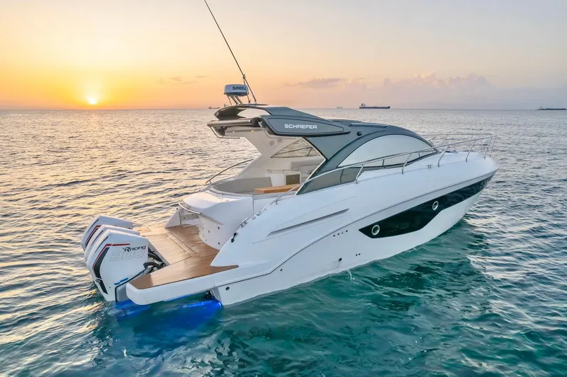 Slide: The Image of 2025 Schaefer 400 Sport yacht at sunset on the ocean. - 10