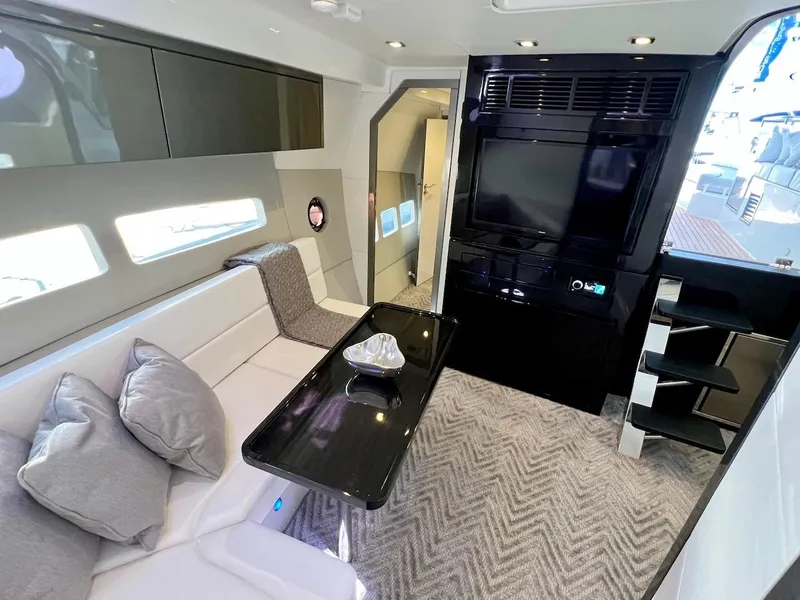 Slide: The Image of Luxurious interior of 2025 Schaefer 400 Sport yacht with modern seating and entertainment system. - 12