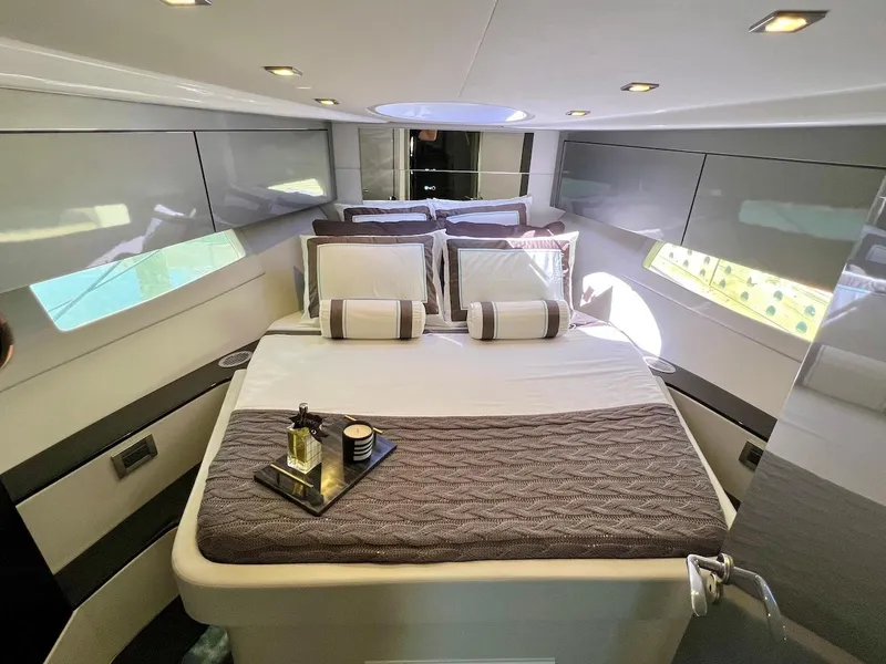 Slide: The Image of Luxurious cabin interior of 2025 Schaefer 400 Sport yacht with elegant bedding. - 13