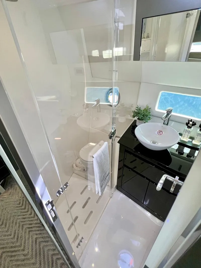 Slide: The Image of Luxurious bathroom in 2025 Schaefer 400 Sport yacht, featuring modern fixtures and elegant design. - 15