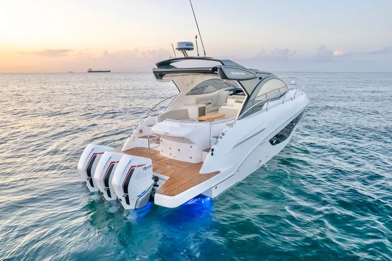Slide: The Image of 2025 Schaefer 400 Sport yacht on open sea at sunset. - 2