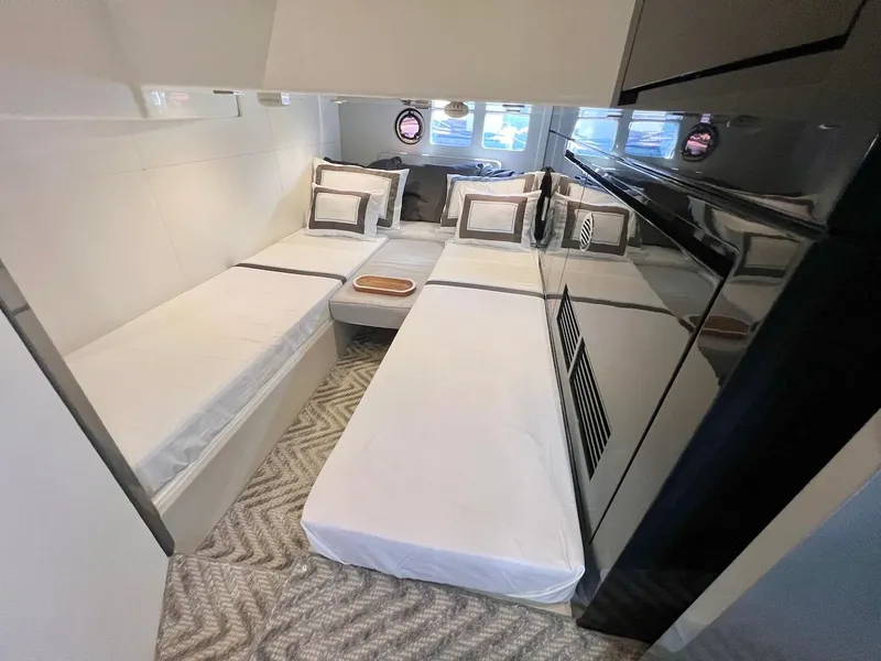 Slide: The Image of Interior of 2025 Schaefer 400 Sport yacht with modern bedding and sleek design. - 22