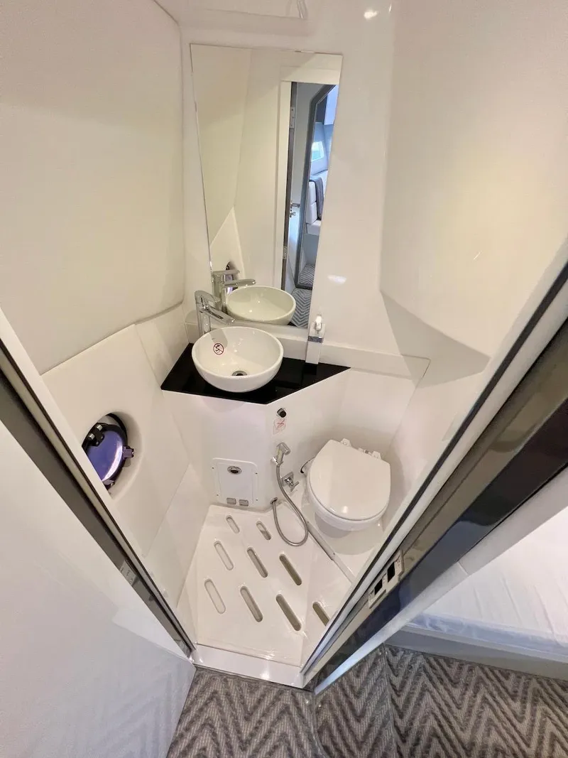 Slide: The Image of Compact bathroom in 2025 Schaefer 400 Sport yacht with modern fixtures and sleek design. - 23