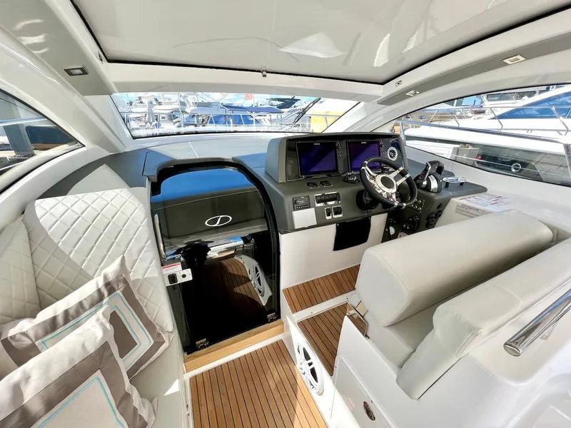 Slide: The Image of Luxurious interior of 2025 Schaefer 400 Sport yacht with modern helm and seating. - 25