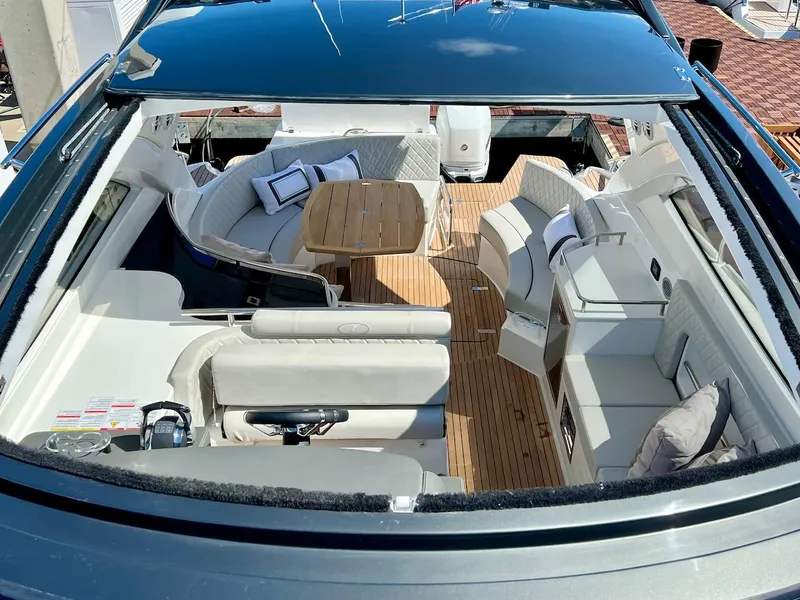 Slide: The Image of Luxurious interior of 2025 Schaefer 400 Sport yacht with elegant seating and wooden table. - 26