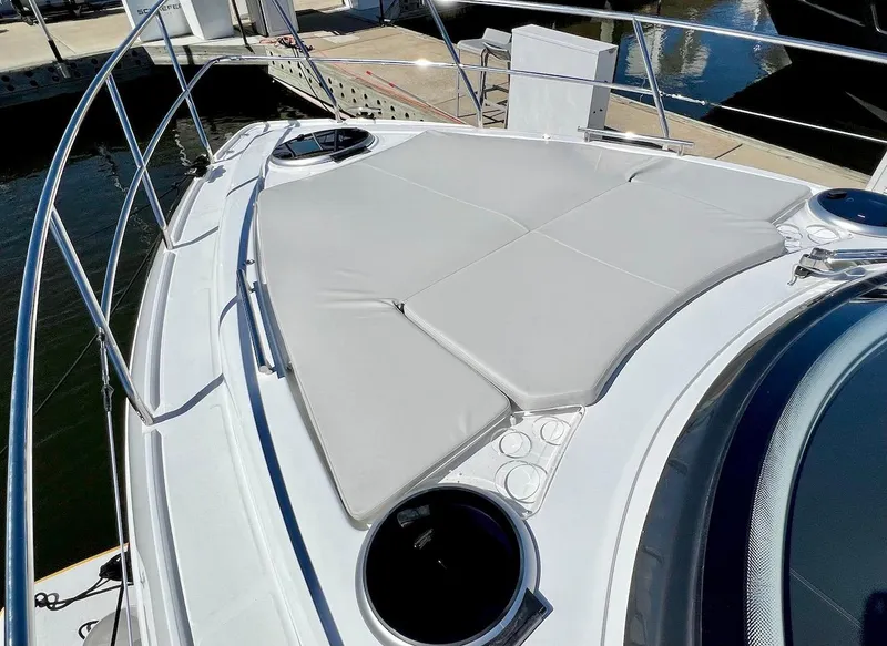 Slide: The Image of 2025 Schaefer 400 Sport yacht with cushioned sunbathing area on deck. - 27