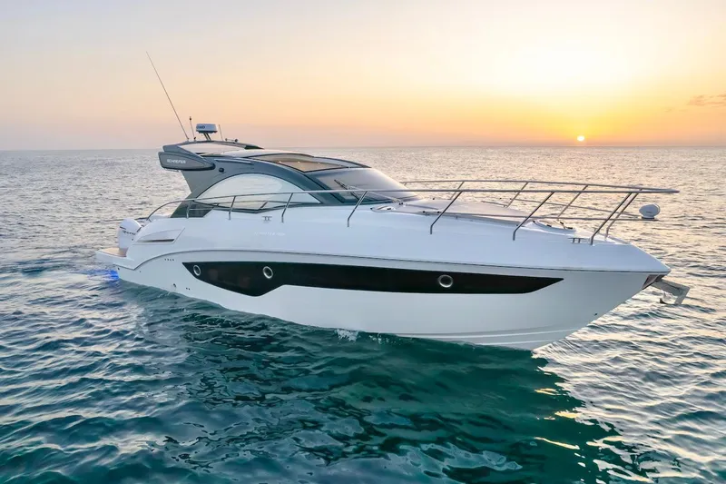 Slide: The Image of 2025 Schaefer 400 Sport yacht cruising at sunset on open sea. - 3