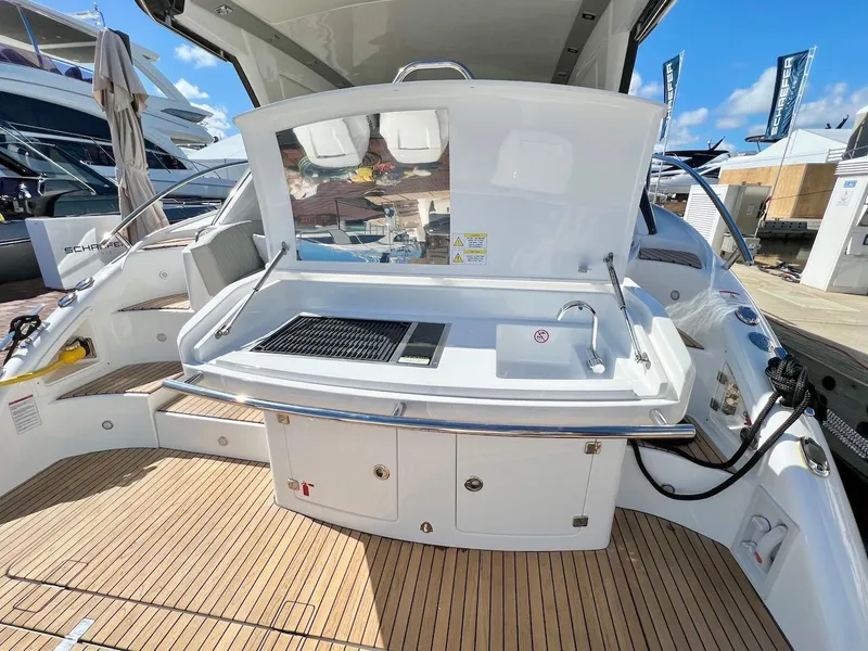 Slide: The Image of Schaefer 400 Sport 2025 yacht deck with outdoor kitchen and sink. - 35