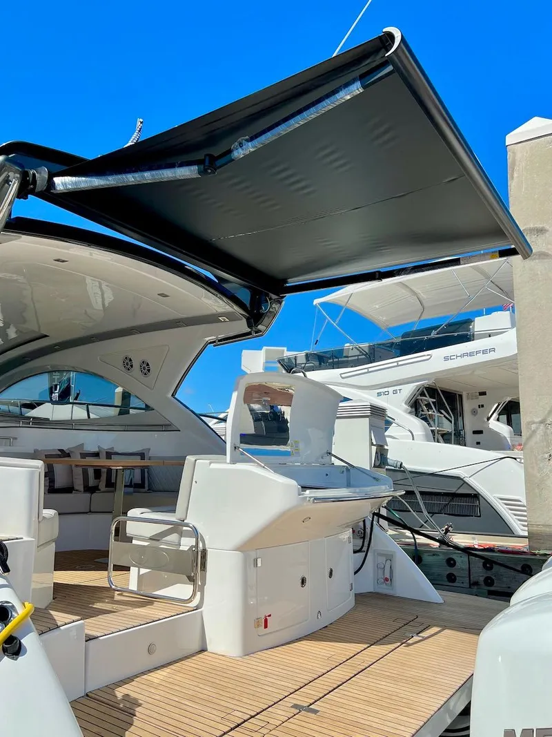 Slide: The Image of 2025 Schaefer 400 Sport yacht with open deck and retractable canopy. - 37