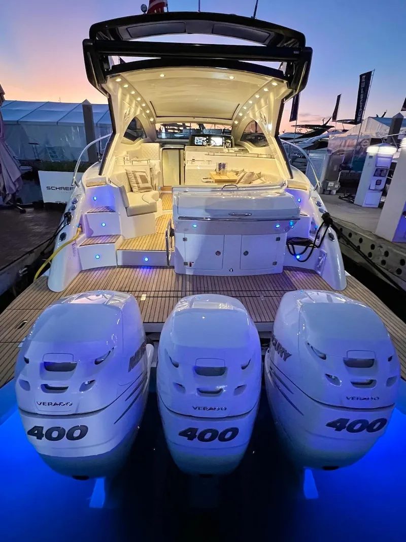 Slide: The Image of 2025 Schaefer 400 Sport yacht with triple Mercury 400 engines at sunset. - 39