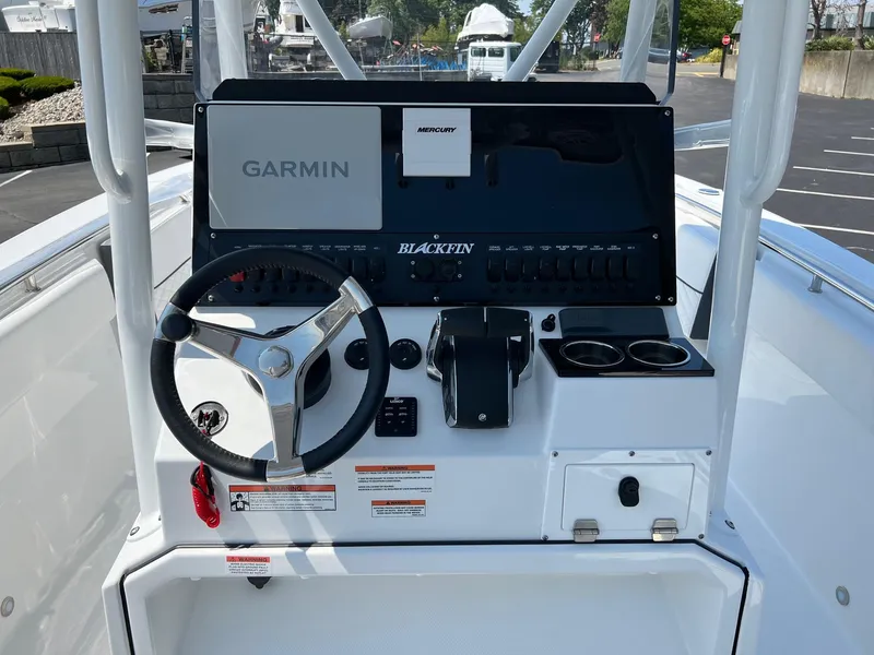 Slide: The Image of 2023 Blackfin 252 CC boat console with Garmin and Mercury controls. - 17
