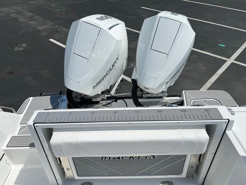 Slide: The Image of 2023 Blackfin 252 CC boat with twin Mercury outboard engines. - 18