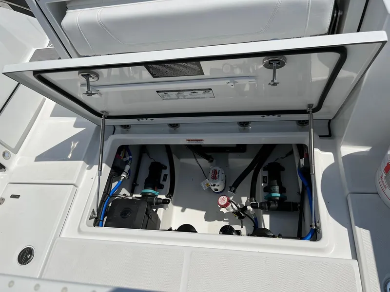 Slide: The Image of 2023 Blackfin 252 CC boat storage compartment with open hatch. - 19