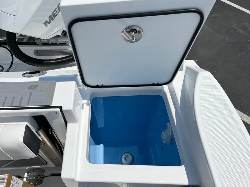 Slide: The Image of 2023 Blackfin 252 CC boat with open storage compartment. - 21
