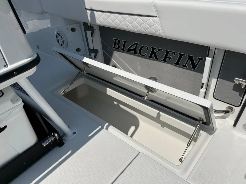 Slide: The Image of 2023 Blackfin 252 CC boat storage compartment with open lid. - 22