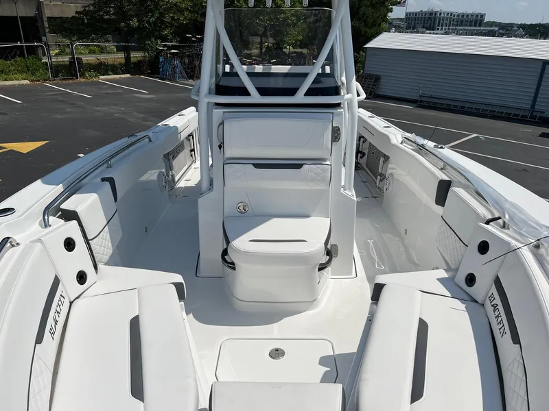 Slide: The Image of 2023 Blackfin 252 CC center console boat with spacious seating and modern design. - 25