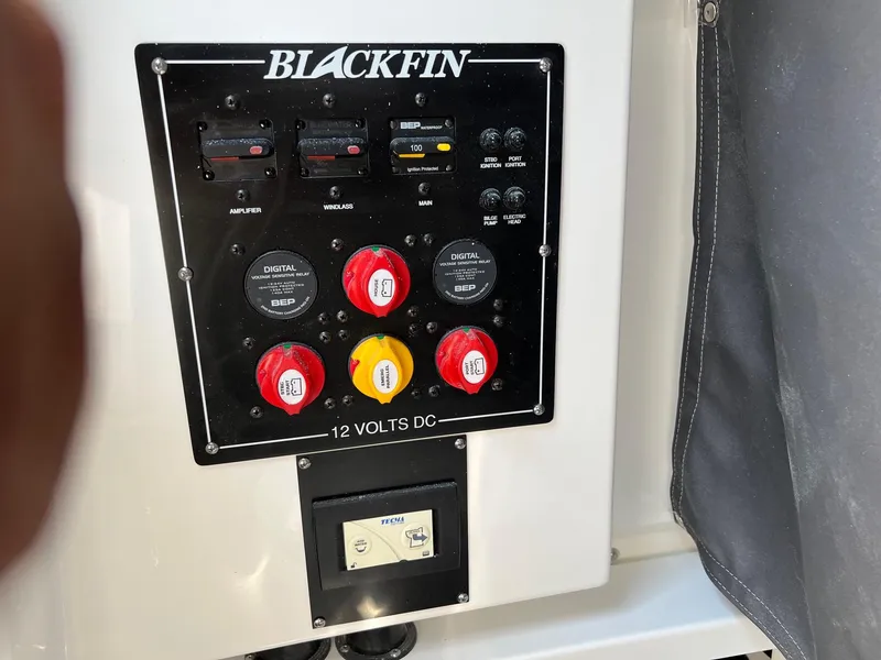 Slide: The Image of 2023 Blackfin 252 CC control panel with switches and dials. - 28