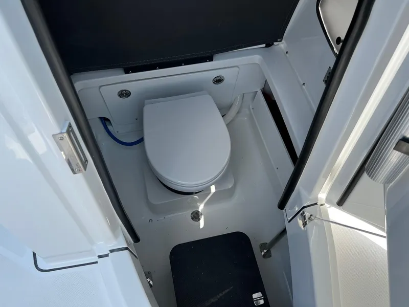 Slide: The Image of 2023 Blackfin 252 CC boat interior with marine toilet. - 30