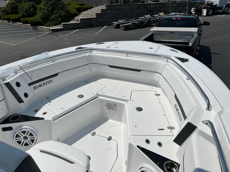 Slide: The Image of 2023 Blackfin 252 CC boat interior with seating and storage compartments. - 31
