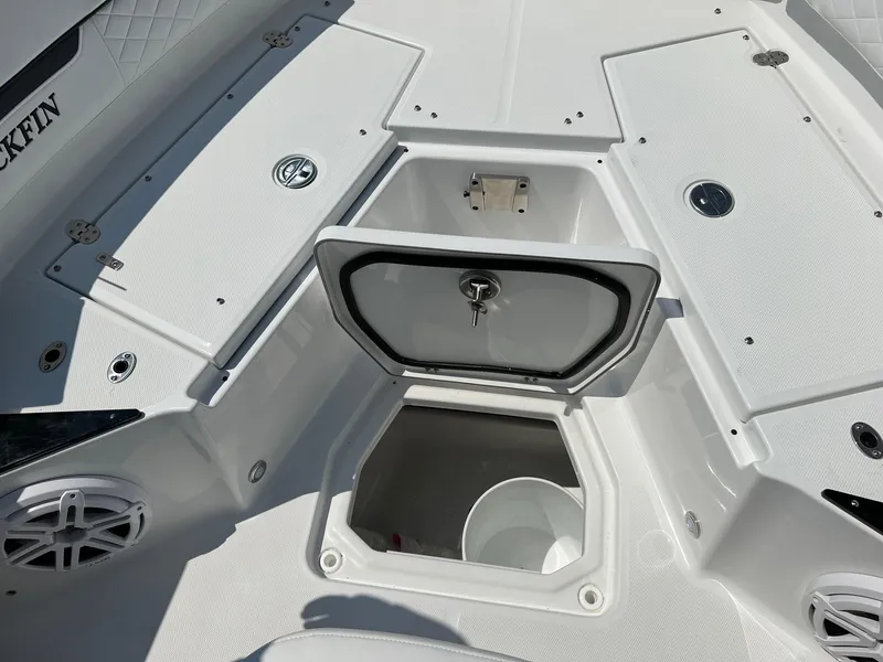 Slide: The Image of 2023 Blackfin 252 CC boat storage compartments and deck. - 32