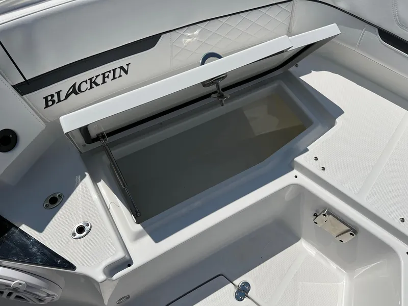 Slide: The Image of 2023 Blackfin 252 CC boat with open storage compartment. - 34