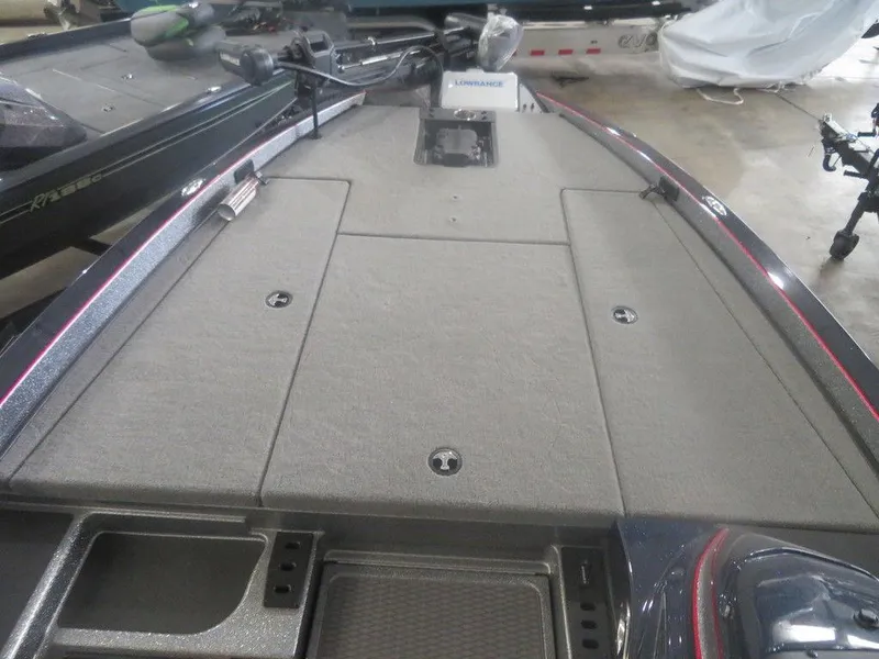 Slide: The Image of 2022 Caymas CX19 boat deck with storage compartments and trolling motor. - 3
