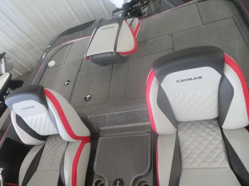 Slide: The Image of 2022 Caymas CX19 boat interior with dual seats and storage compartments. - 6