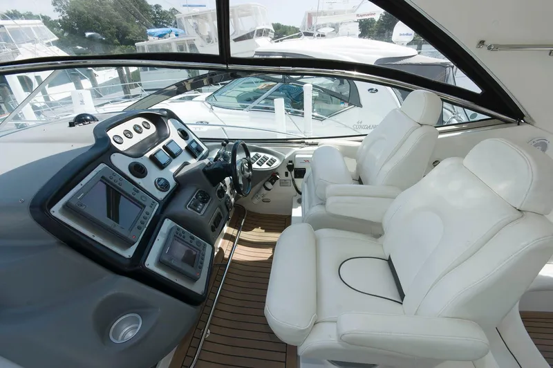 Slide: The Image of Interior of a 2005 Cruisers Yachts 520 Express with luxurious seating. - 10