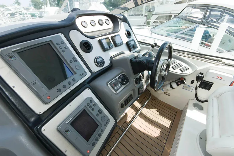 Slide: The Image of 2005 Cruisers Yachts 520 Express cockpit with modern navigation. - 11