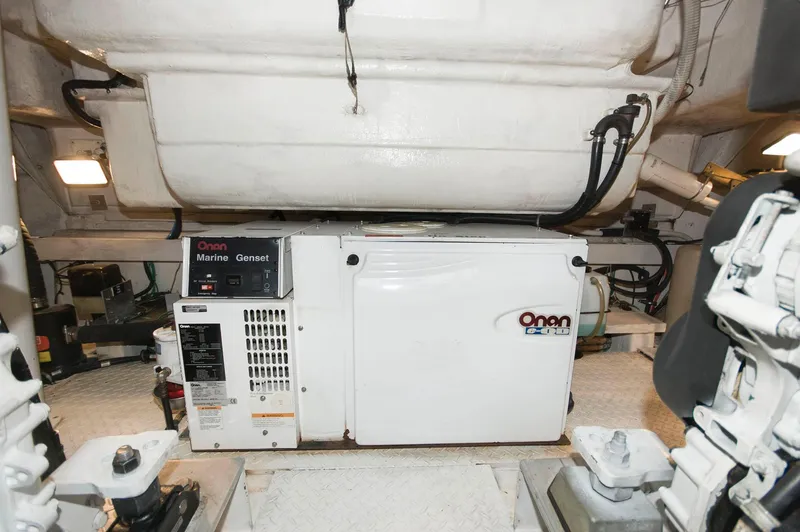 Slide: The Image of Onan marine generator in the engine room of 2005 Cruisers Yachts 520 Express. - 35