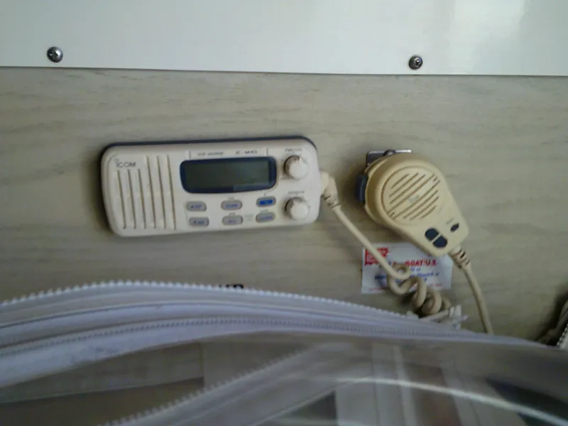 Slide: The Image of ICOM marine radio and microphone on a 1980 Bertram 28 Flybridge Cruiser. - 11