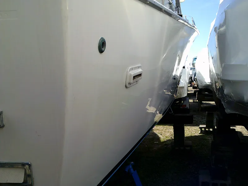 Slide: The Image of 1980 Bertram 28 Flybridge Cruiser side view in dry dock. - 26