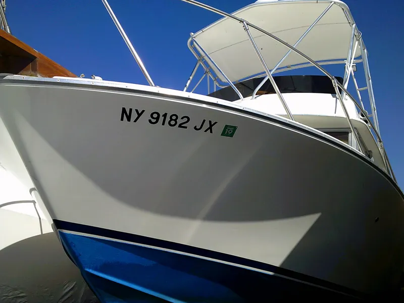 Slide: The Image of 1980 Bertram 28 Flybridge Cruiser boat with registration number NY 9182 JX. - 29
