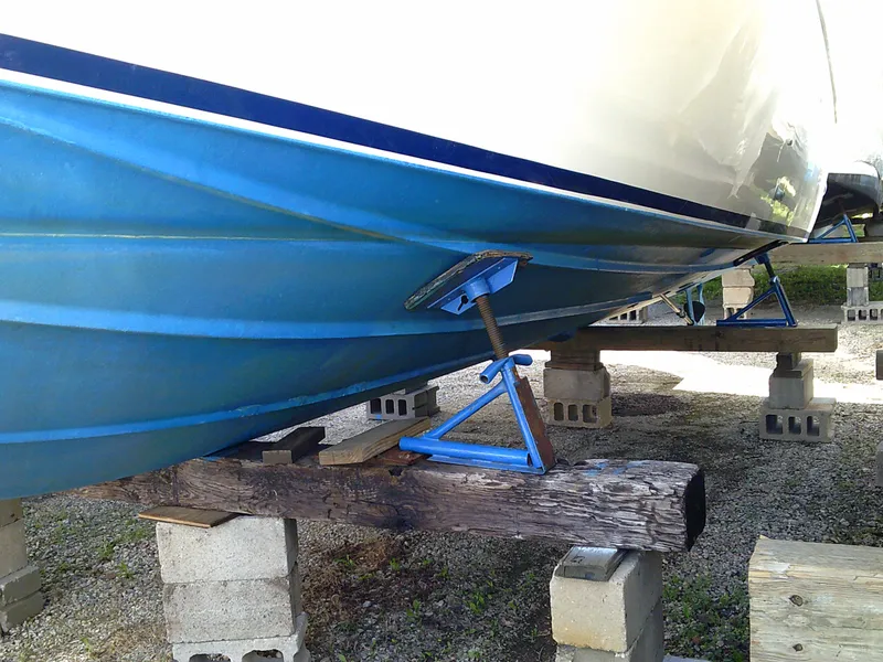 Slide: The Image of 1980 Bertram 28 Flybridge Cruiser on blocks for maintenance. - 31