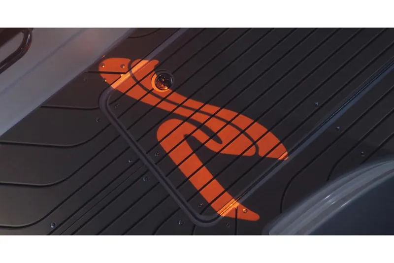 Slide: The Image of 2023 Sea Ray SLX 260 deck with illuminated logo. - 18