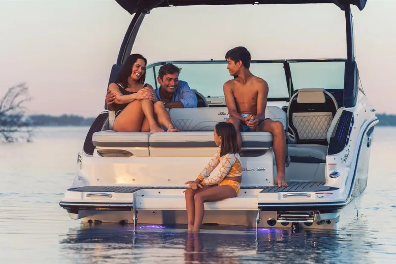Slide: The Image of Family enjoying sunset on 2023 Sea Ray SLX 260 boat. - 7