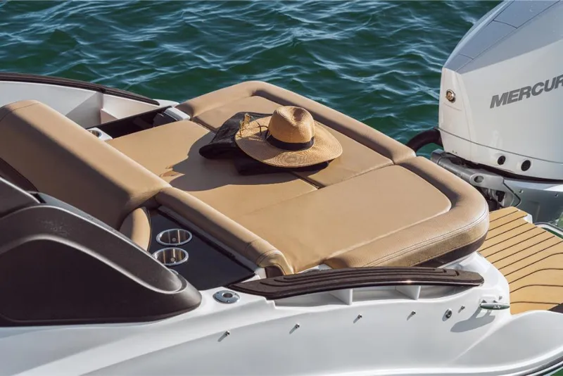 Slide: The Image of 2023 Sea Ray SLX 260 OB boat with sun hat on tan lounge seat. - 30