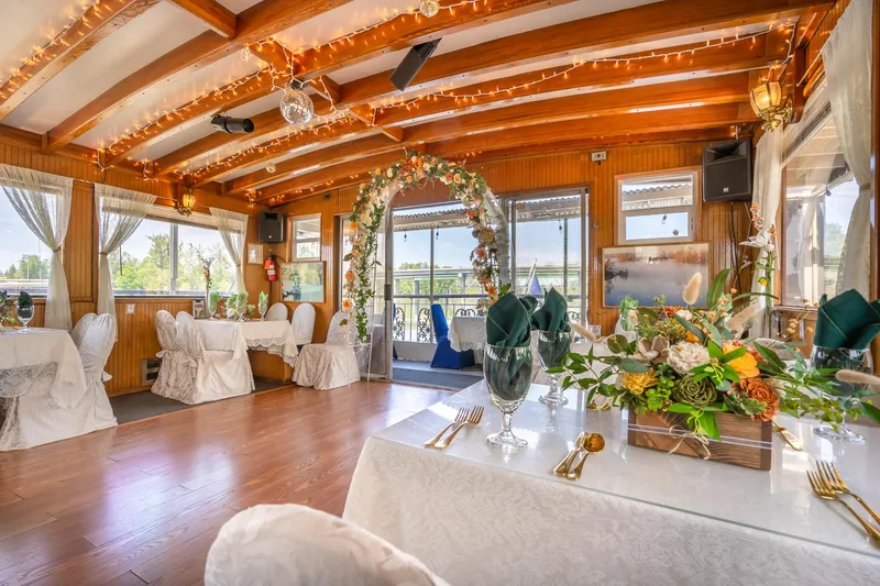 Slide: The Image of Elegant interior of 1990 Howdy Eidelman Sternwheeler, decorated for an event with floral arrangements. - 15