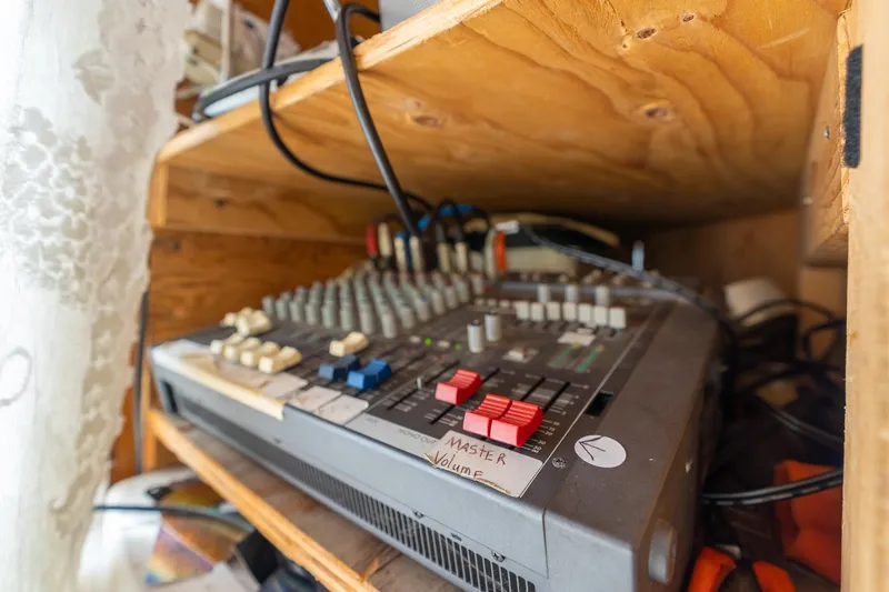 Slide: The Image of Audio mixer with labeled controls in a wooden shelf, 1990 Howdy Eidelman Sternwheeler. - 27