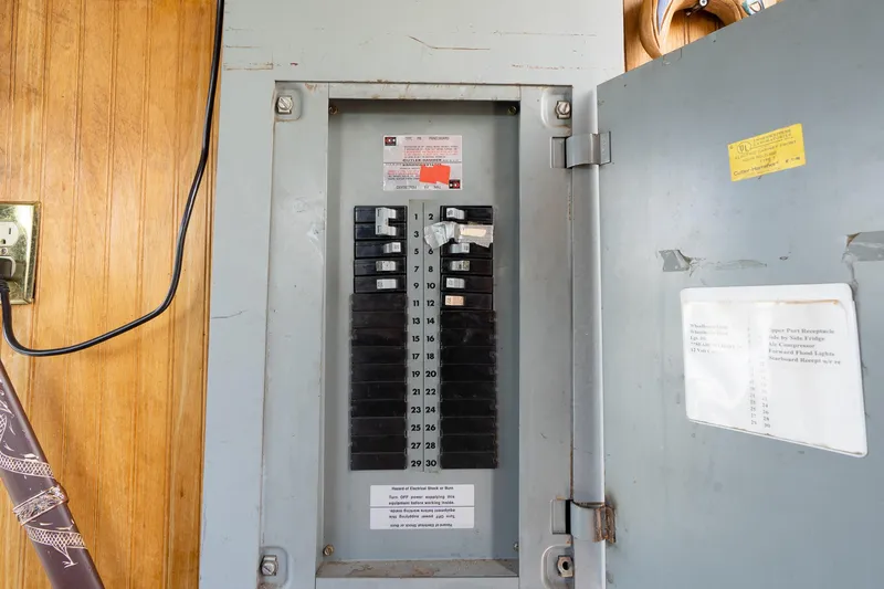 Slide: The Image of Electrical panel inside 1990 Custom Howdy Eidelman Sternwheeler, Jack Sarin model, with open door. - 31