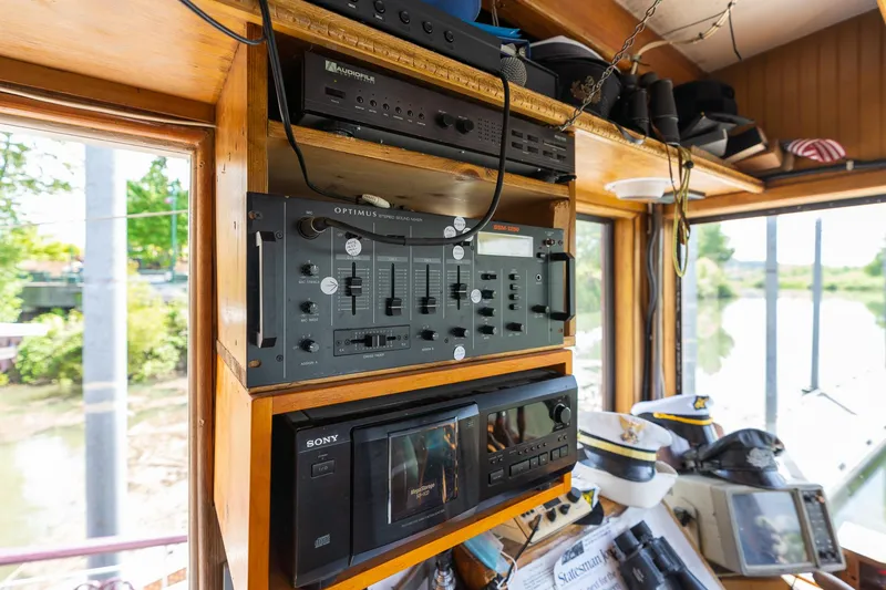 Slide: The Image of Interior of 1990 Howdy Eidelman Sternwheeler with vintage audio equipment and scenic window view. - 32