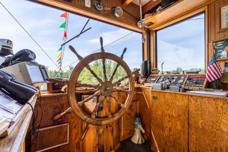 Slide: The Image of Wooden helm of 1990 Custom Howdy Eidelman Sternwheeler, Jack Sarin design, with nautical instruments. - 33